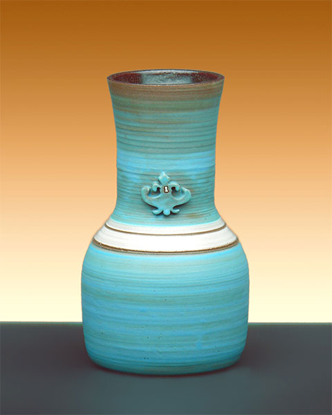 turquoise vase with white stripes